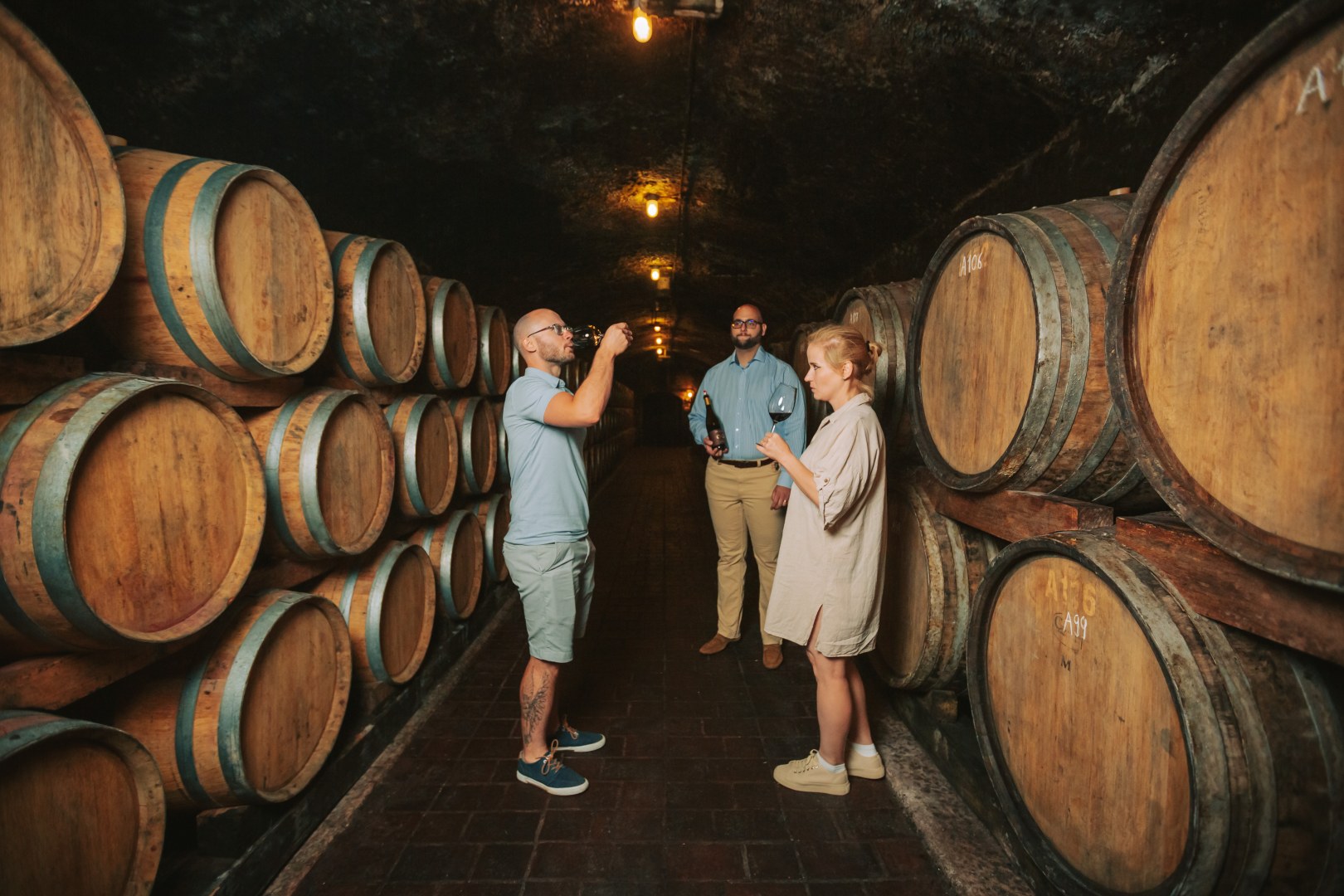 Visitors sample red wine at Juhász Testvérek Winery in Eger