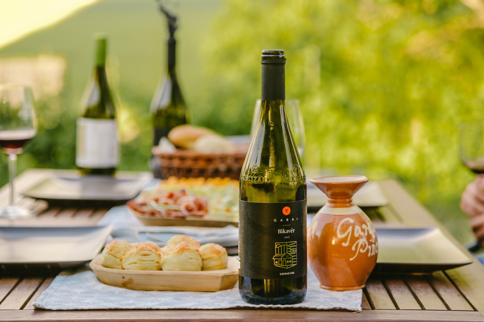 Garai wine on a table with baked products